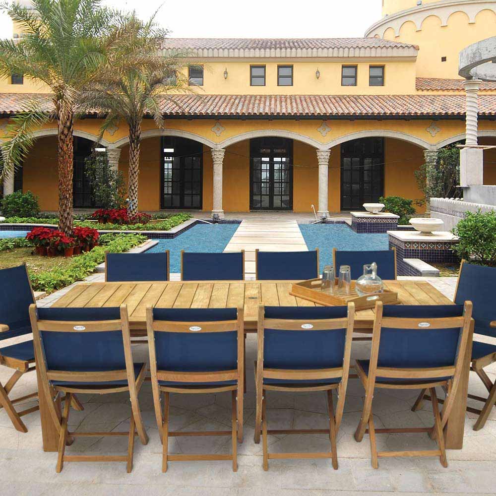 Teak sling dining chairs with dark blue fabric seats and backs, outdoor patio set