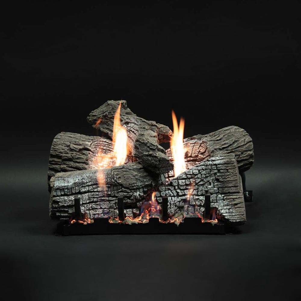 Stacked refractory gas logs with glowing flames and textured logbed