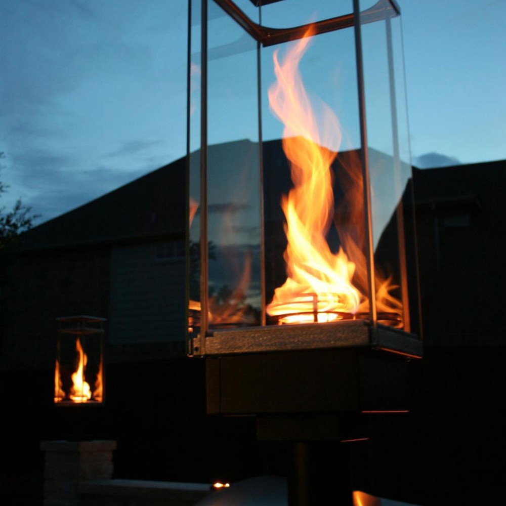 Glass-enclosed gas torch flame in metal burner housing, electronic ignition system