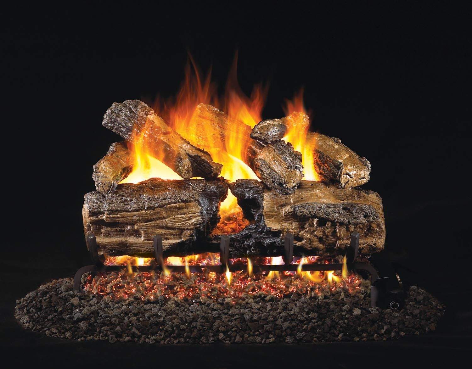 Vented gas log set with charred split oak logs and tall orange flames