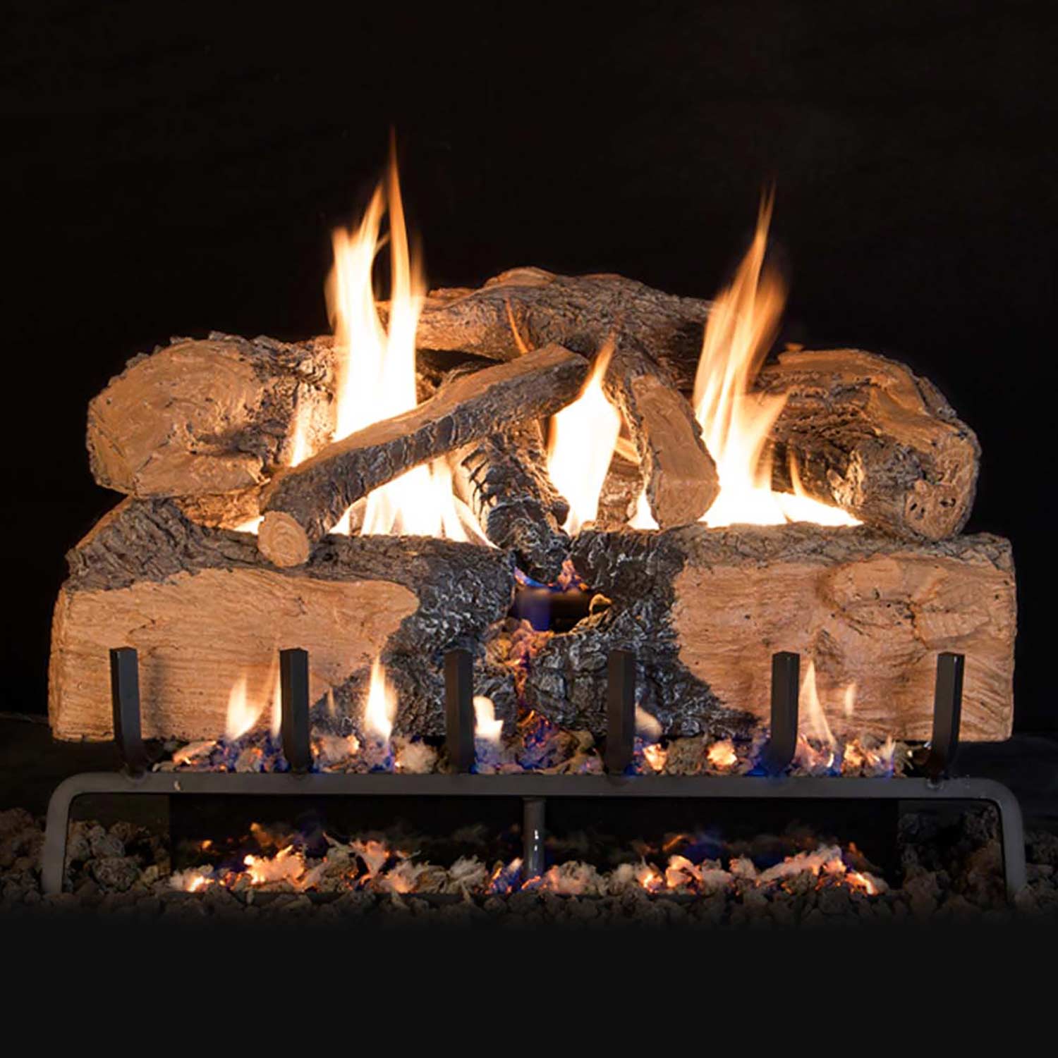 Charred split oak vented gas logs with glowing embers and flames