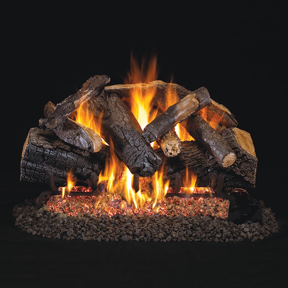 Charred vented gas log set with burning flames and dark oak logs