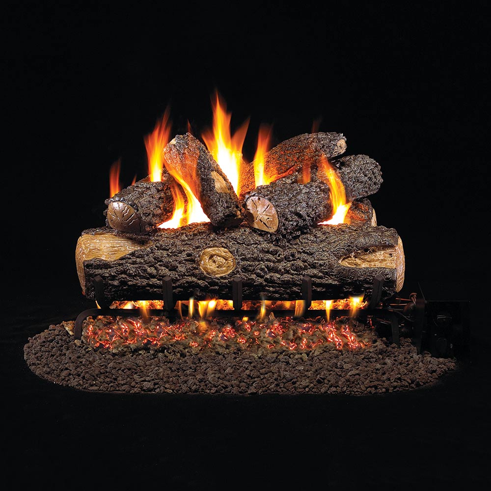 Vented gas log set with faux oak logs and glowing flames over an ember bed