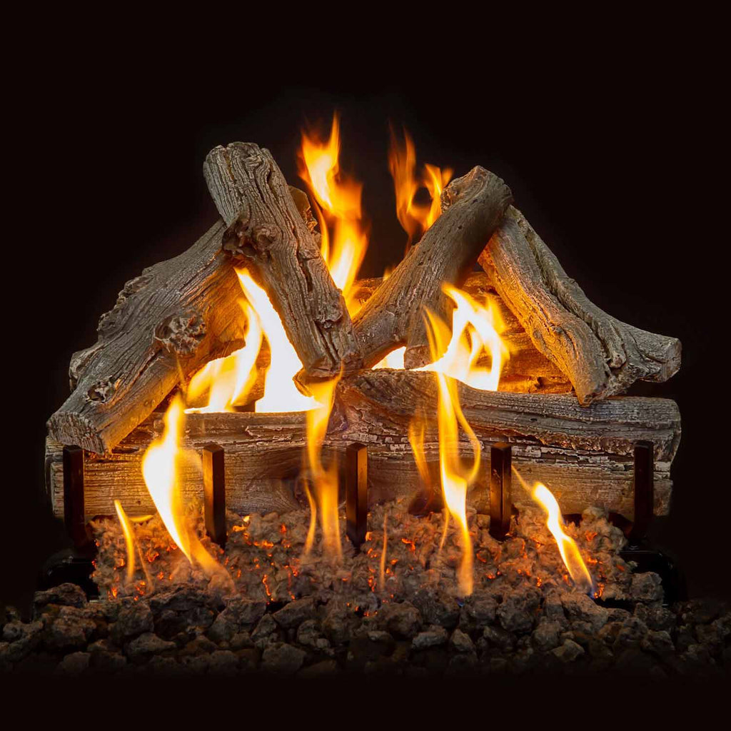 Driftwood-style gas log set with visible flames rising between stacked logs