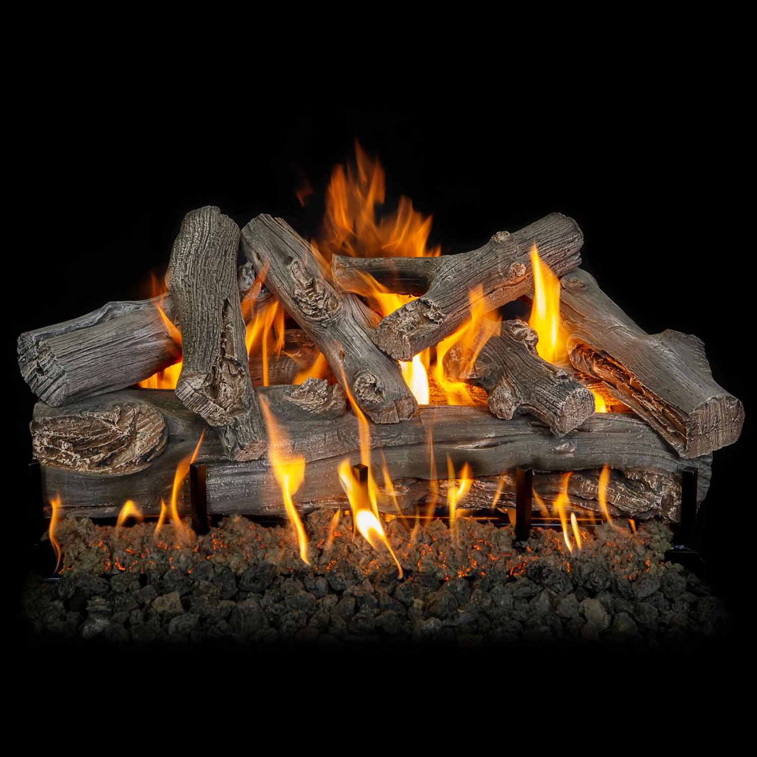 Gas log set with gray driftwood logs, flames rising above fire stones