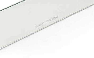 Clear glass wind guard panel edge with small metal end caps
