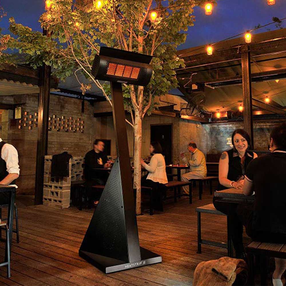 HEATSTRIP portable LPG gas heater glowing above wooden deck with black triangular stand