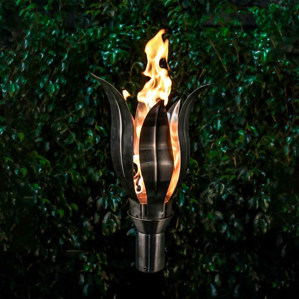 Outdoor flower torch with stainless steel body and open flame, gas-powered.