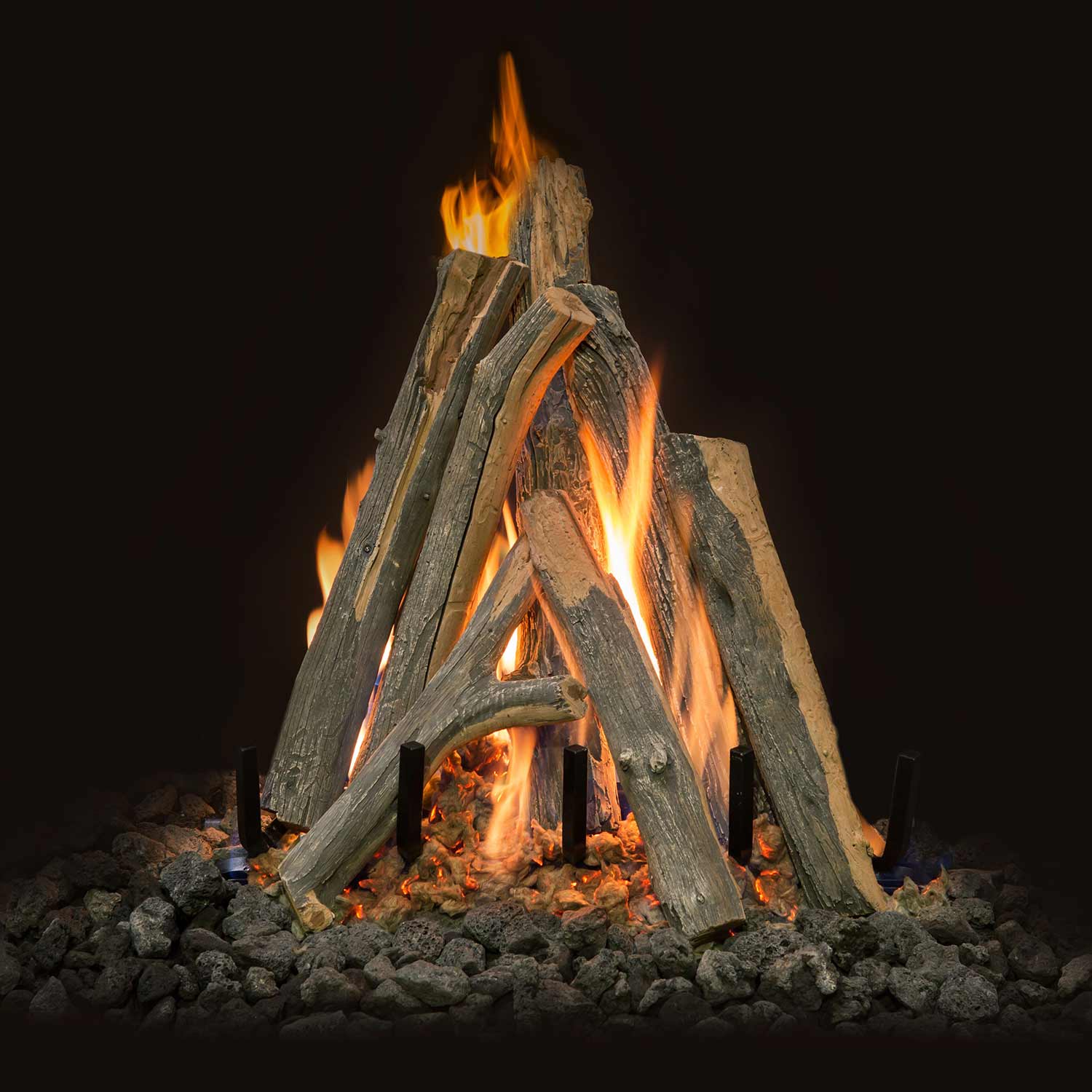 Burning gas log set with arched juniper-style logs and orange flames on lava rocks