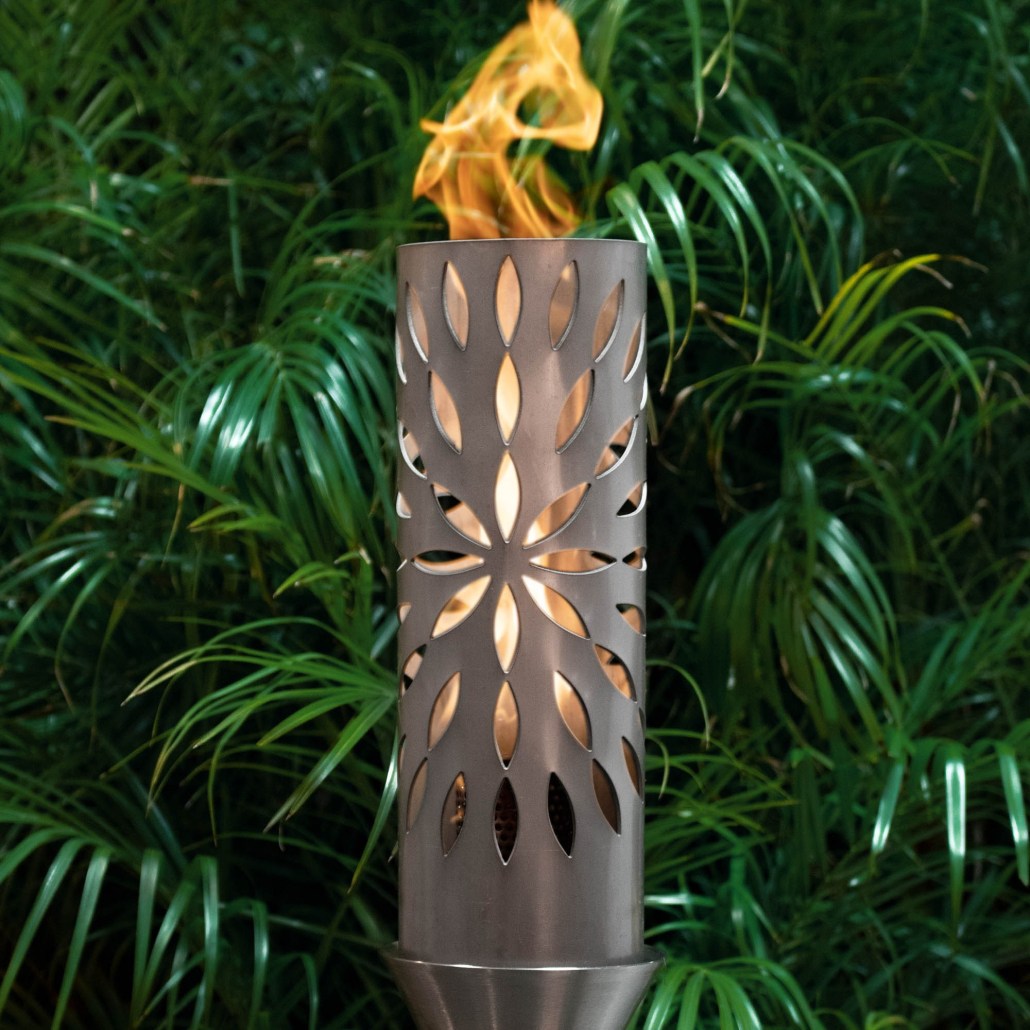 Outdoor metal torch with flame, cylindrical cutout design and tall stand